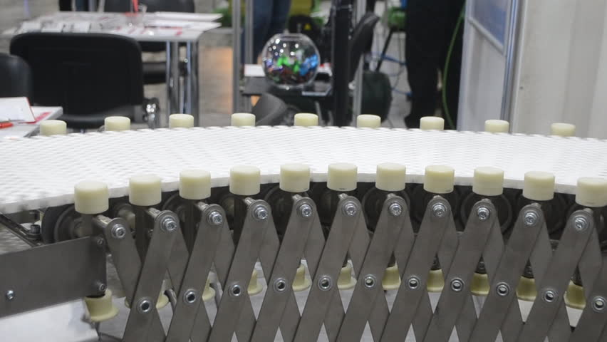 Modular belt rotary conveyor. Continuous movement system. Transportation of materials or products. Conveyors for moving objects. Production manufacture. Moving industrial belt. Connected plastic links