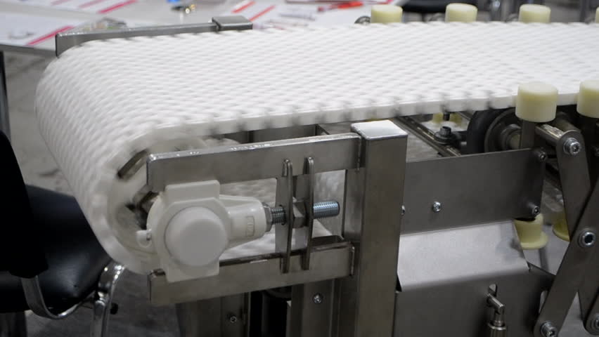 Modular belt rotary conveyor. Continuous movement system. Transportation of materials or products. Conveyors for moving objects. Production manufacture. Moving industrial belt. Connected plastic links