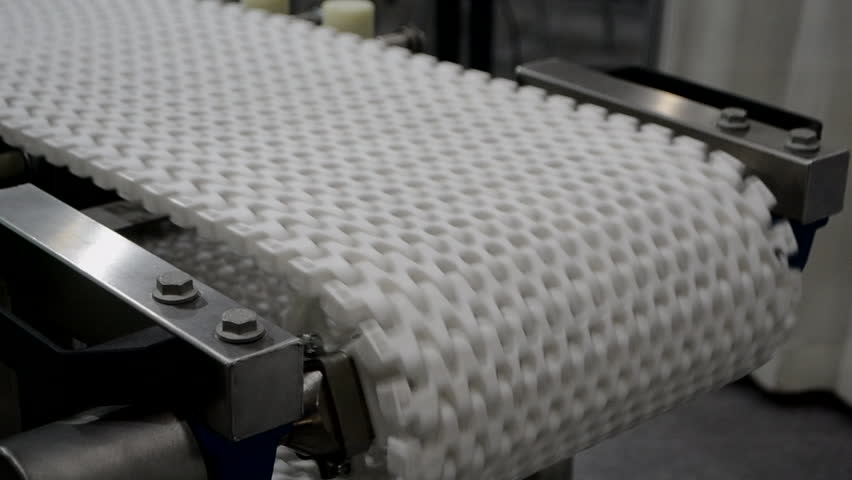 Modular belt rotary conveyor. Continuous movement system. Transportation of materials or products. Conveyors for moving objects. Production manufacture. Moving industrial belt. Connected plastic links