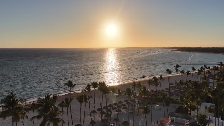 Sunrise Beach At Bavaro In Punta Cana Dominican Republic. Sunrise Skyline. Beach Landscape. Nature Seascape. Sunrise Beach In Bavaro In Punta Cana Dominican Republic. Scenic Palm Trees.