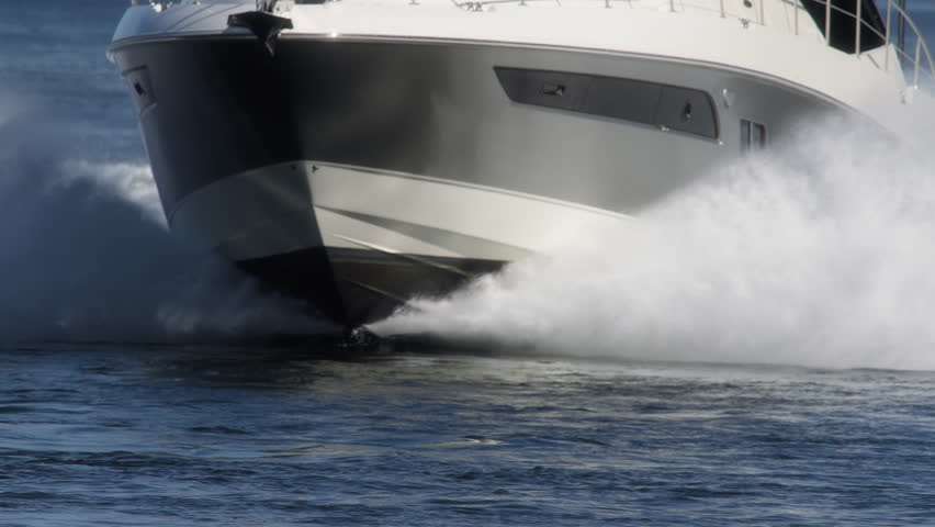 Close up of a yacht sailing through waters near Vancouver Island. Slow motion.