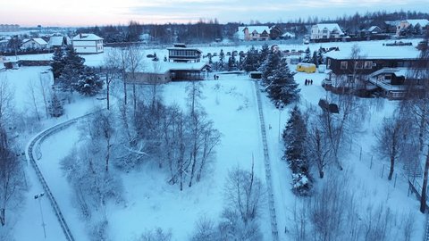 Drone Flying Forward Left over Snowy Village