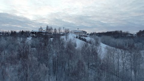 Drone Rising Turning above Snowy Ski Slope
