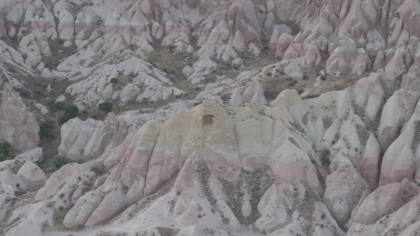 D-Log M. Goreme, Nevsehir, Turkey. Abstract patterns and textures of multicolored rock formations in Red Valley, Cappadocia at sunset. Aerial View, MasterShots, Circle (Close)