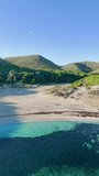 Aerial Drone Trucking Shot of Empty Cala Torta Beach in Mallorca: Wild Mediterranean Coastline moving Right to Left. - Powered by Shutterstock - Get 15% off with code: PIKWIZARD15
