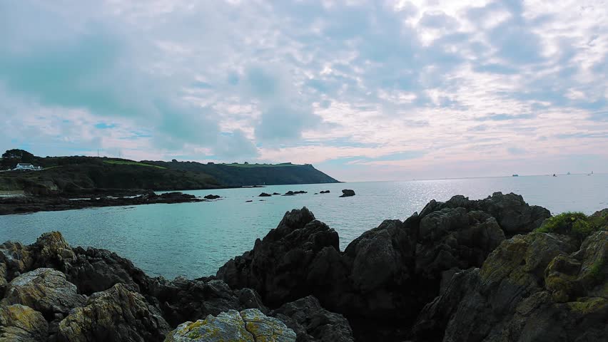 peaceful seaside landscape with natural elements, tranquil seaside scene featuring waves and cliffs