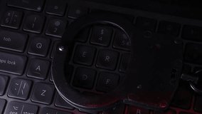 Handcuffs resting on a dark keyboard illuminated by blue light, symbolizing crime, justice, and law enforcement in a digital age with a focus on security and technology - Powered by Shutterstock - Get 15% off with code: PIKWIZARD15