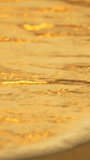 Water, waves, sand Golden sunset reflections wash over tropical beach sand in mesmerizing slow motion close up Vertical video - Powered by Shutterstock - Get 15% off with code: PIKWIZARD15