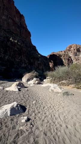 Approaching Shadowy Entrance to Slot Canyon with Boulders (Big Bend Ranch State Park, Texas, USA)