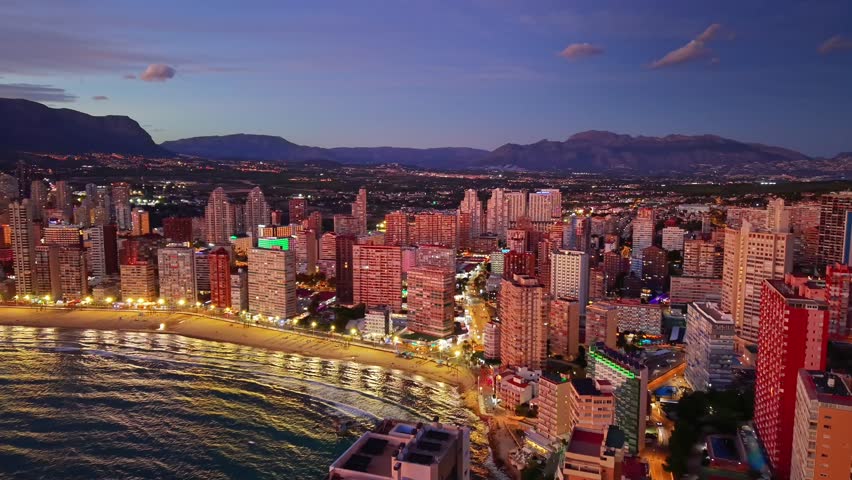 Twilight Coastline With Lit Promenade And Waves, Tourism Board Evening Shoot Showcasing Illuminated Hotels,