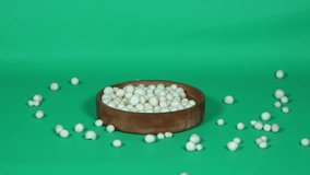 Crackers are spilled onto a green background, creating a natural and dynamic snack arrangement. Ideal for snack ads, food styling, and casual food visuals. - Powered by Shutterstock - Get 15% off with code: PIKWIZARD15