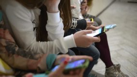 Children using smartphones and mobile phones in school, digital learning, technology in education, social interaction, and modern classroom environment. - Powered by Shutterstock - Get 15% off with code: PIKWIZARD15