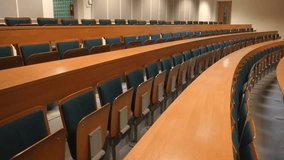 Empty college university auditorium classroom with rows of seats and desks, modern education interior, academic environment, lecture hall without people. - Powered by Shutterstock - Get 15% off with code: PIKWIZARD15