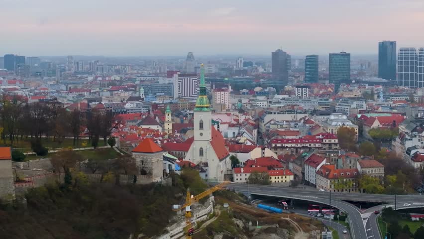 4K cinematic drone footage of St. Martin’s Cathedral in Bratislava, revealing the architectural beauty, bustling surroundings, and historic atmosphere of central Bratislava._059