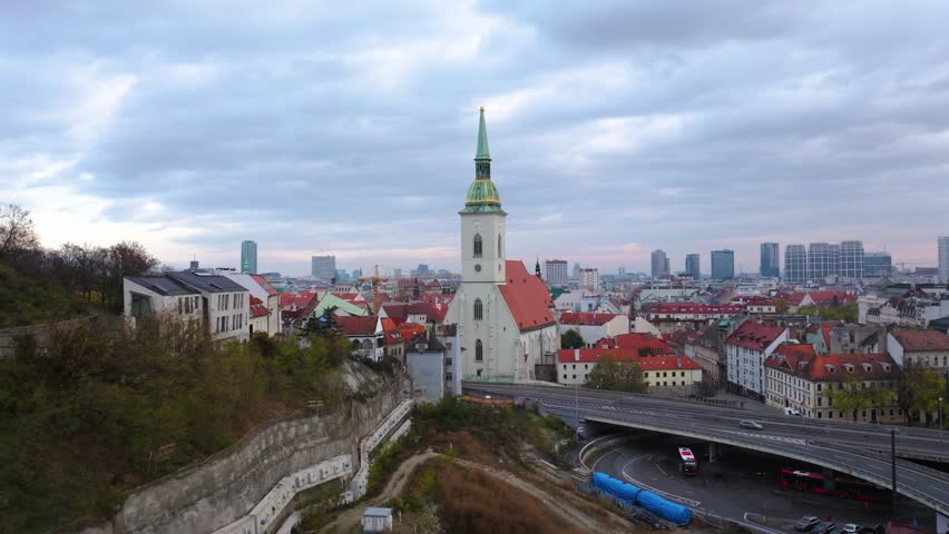 4K cinematic drone footage of St. Martin’s Cathedral in Bratislava, revealing the architectural beauty, bustling surroundings, and historic atmosphere of central Bratislava._051