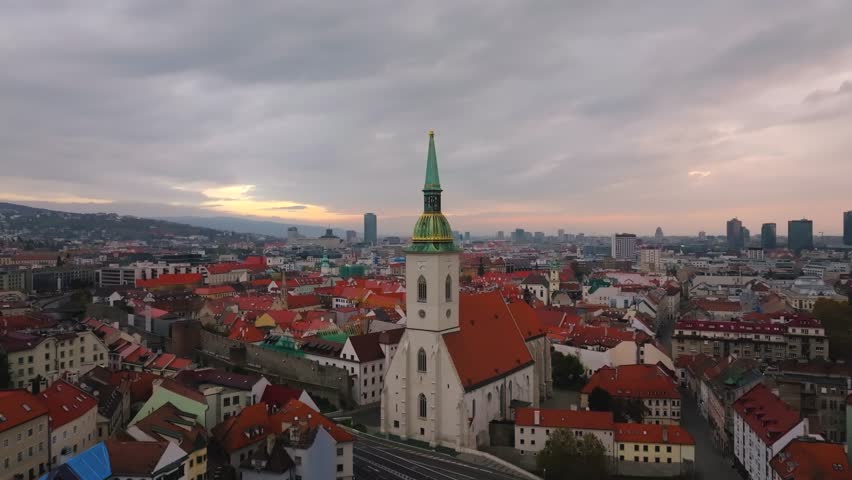 4K cinematic drone footage of St. Martin’s Cathedral in Bratislava, revealing the architectural beauty, bustling surroundings, and historic atmosphere of central Bratislava._021