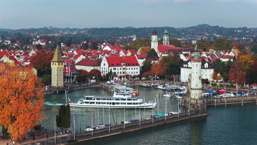 Obersee Bodensee Landau Lake Constance marina harbor view sailboat ferry boat Germany Switzerland aerial drone island fall autumn leaves golden hour sunset clouds European circle right motion
