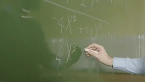 Teacher Hand Writing Polynomial Algebra Formula on School Blackboard - Powered by Shutterstock - Get 15% off with code: PIKWIZARD15
