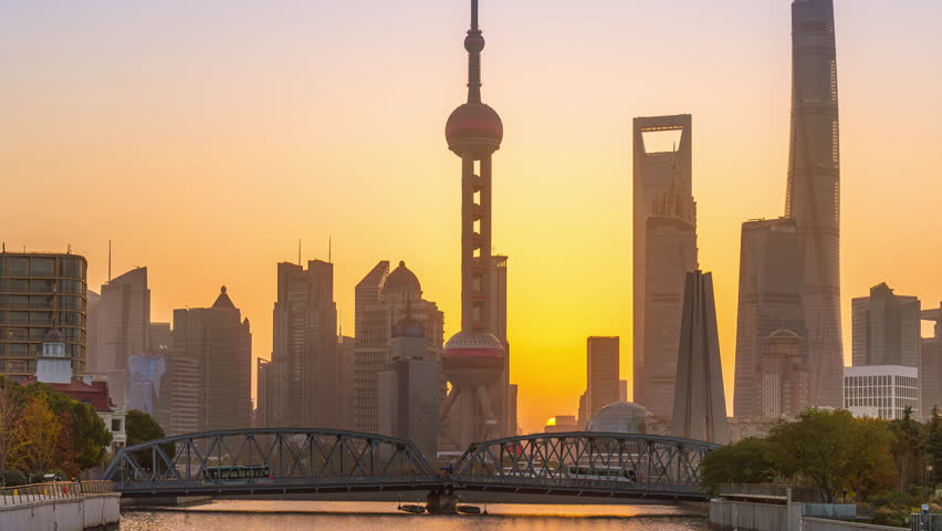 Timelapse of Shanghai city and Huangpu river at sunrise, China.