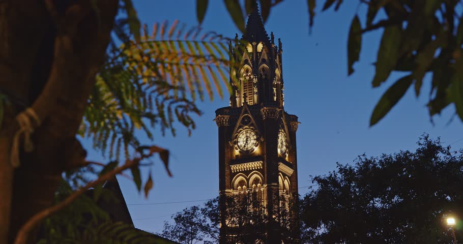 Rajabai Clock Tower In Evening Illumination. Clock Tower In Mumbai India. Confines Of Fort Campus Of University Of Mumbai. Modeled It On Big Ben In London. It Stands At Height Of 85 M Or 280 Ft