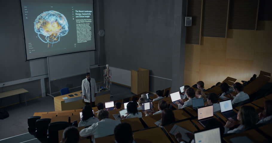 Neuroscience Professor in Lab Coat Delivers Advanced Brain Lecture in a University Auditorium, Using Glowing Neural Imaging, Education for Careers in Neurology, Psychiatry, Neurosurgery, and Radiology