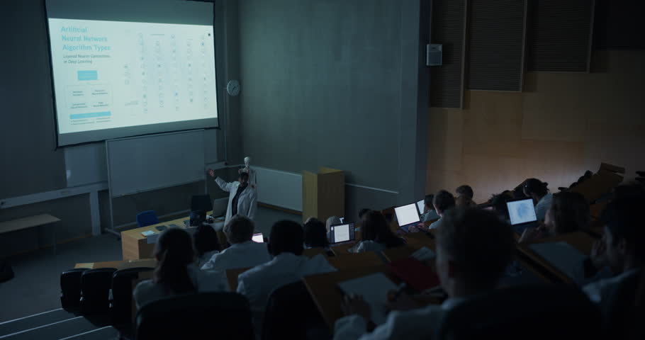 Science Professor in Lab Coat Teaches Artificial Neural Network Algorithms to University Students in Lecture Hall, Using Projector Slides, Laptops, Advanced Medical Education, Data Science Training