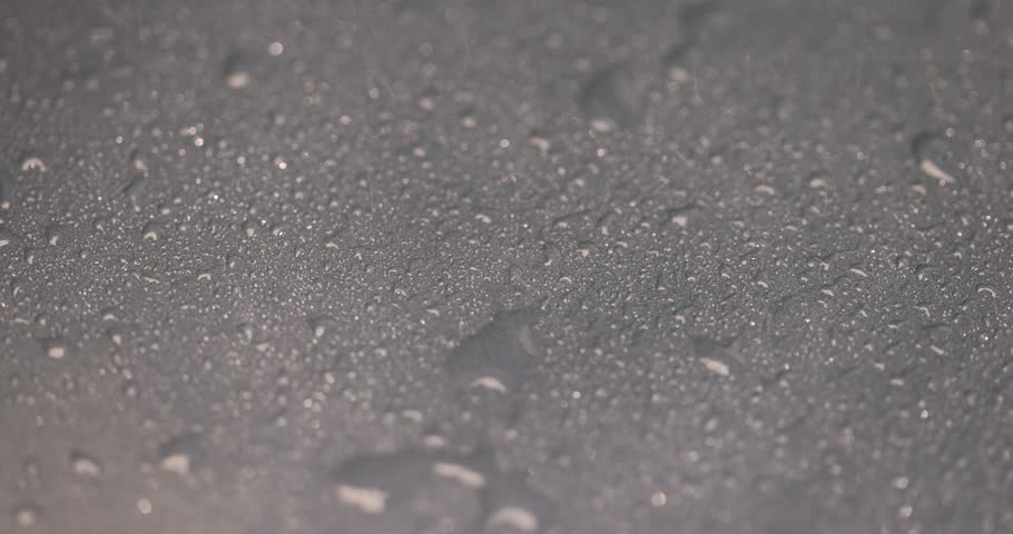 ceramic bowl covered with water droplets made of baked clay and painted blue, wet ceramic bowl beautifully evenly colored blue for eating and serving dishes