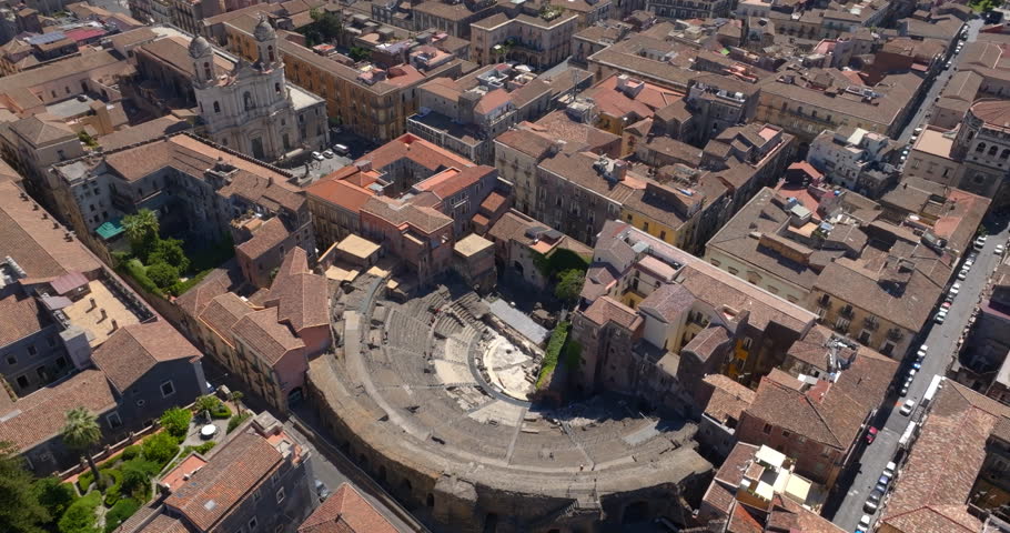 Aerial view of the Amphitheater of Catania, in Sicily, Italy. It is an ancient amphitheater in Southern Italy, built in the Roman Imperial period. It is located in the historic center of the city.