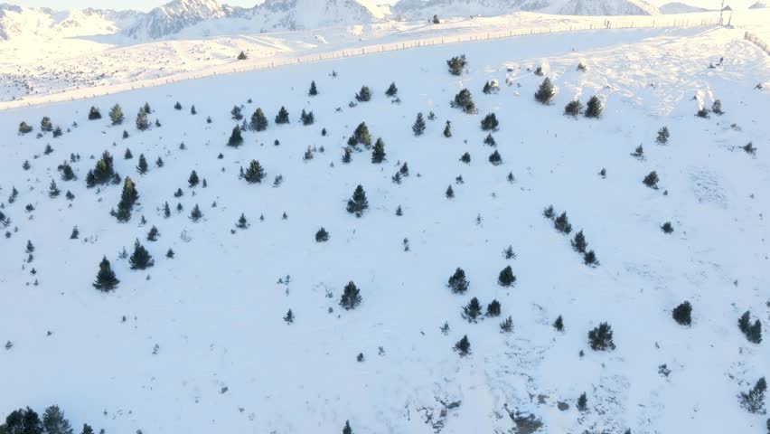 A snowboarder going off-piste in Grandvalira Andorra, filmed with a drone