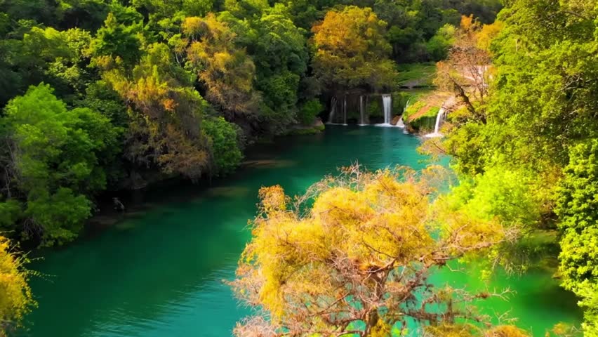 Dreamlike Tropical Paradise with Tiered Falls and Vibrant Green Canopy