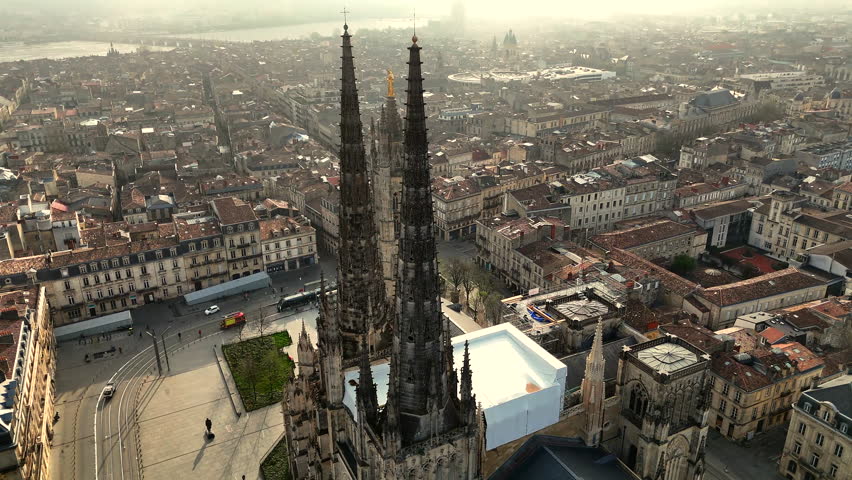 Aerial view Bordeaux Saint-Andre Cathedral spires Pey Berland tower golden hour