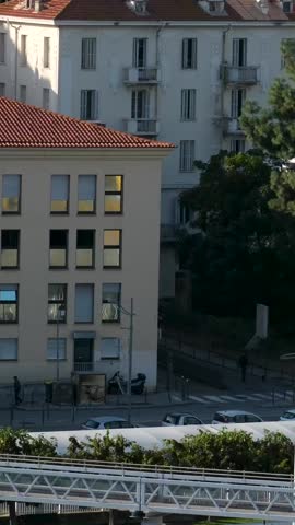Scenic coastline of Corsica island seen from cruise ship with green hills rocky cliffs turquoise sea and coastal towns in sunlight Mediterranean travel destination natural landscape and summer view