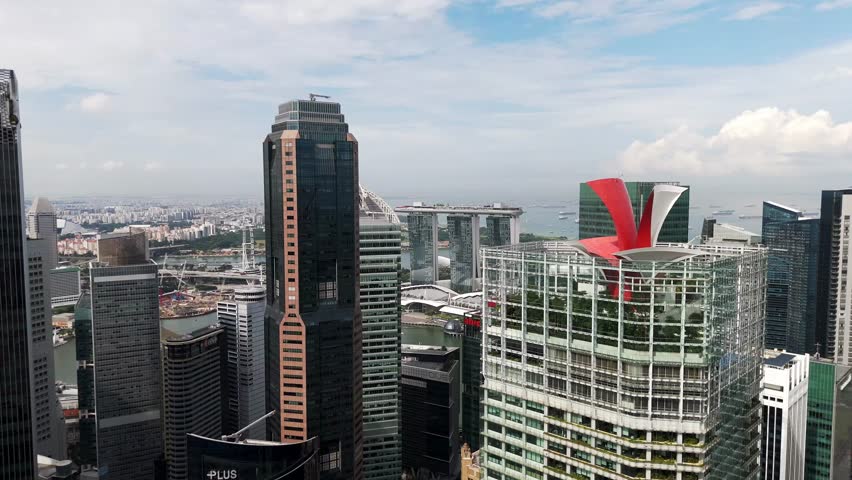 Modern Singapore skyline featuring Marina Bay Sands in the background, showcasing skyscrapers, waterfront architecture, business district, and the dynamic urban development of a global financial city