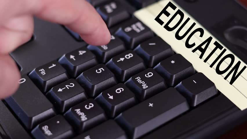 A close-up of a number keypad with an adult woman