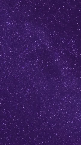 Time‑lapse of the Milky Way and moonrise over a majestic mountain landscape at night, revealing stars, galaxies and shifting light in a tranquil, awe‑inspiring natural scene.