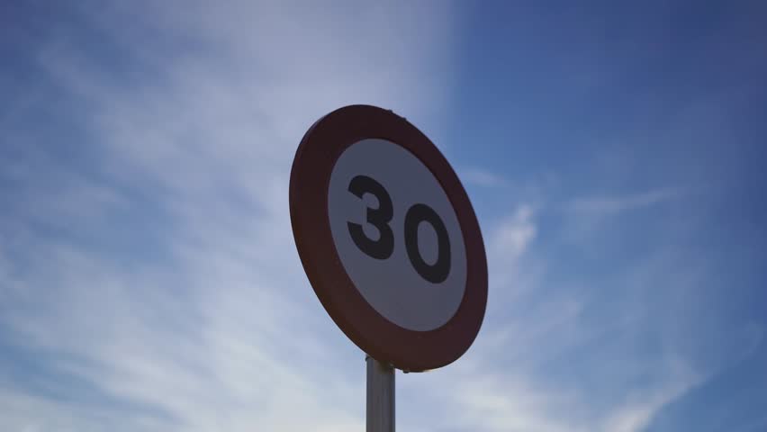 Traffic sign with a speed limit for cars of 30 kilometers per hour