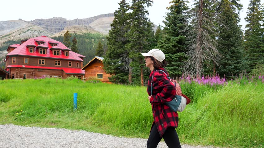 Num ti jah lodge, a historic backcountry lodge, welcomes tourists visiting bow lake in banff national park, offering stunning views of the canadian rockies