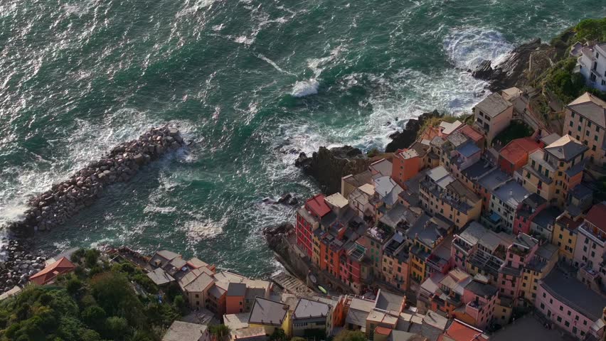 Fishing Village of Riomaggiore at sunset, Aerial View in Cinque terra coast in Italy, Italian riviera in Liguria.
