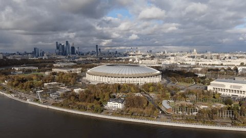Backward Upward Drone Movement above Urban Panorama
