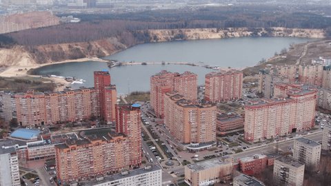 Drone Flying Backward over Residential District Lake