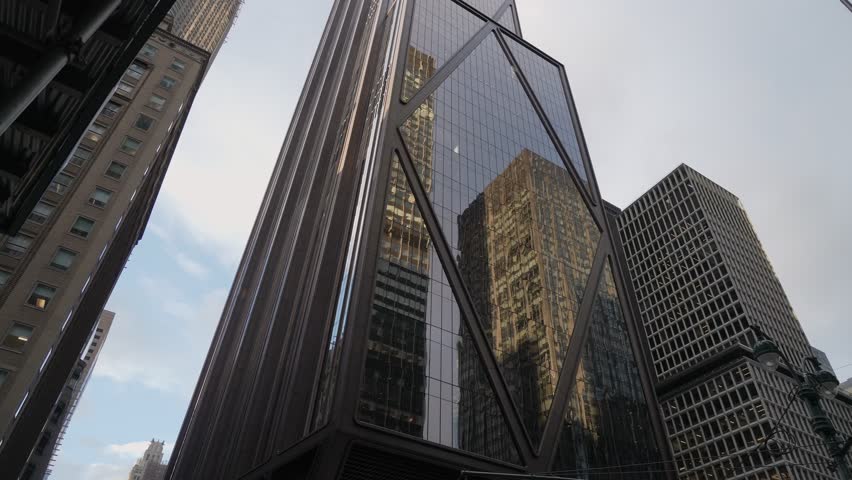 Golden Glass Tower Reflecting Surrounding Buildings In Sharp Angular Geometry, LowAngle Perspective Captures Mirrored Facades, Corner