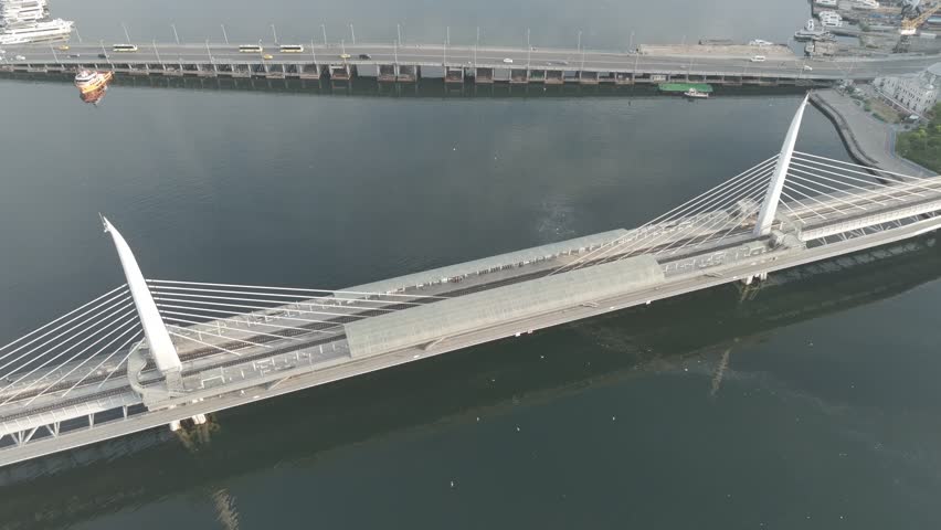 D-Log M. Istanbul, Turkey. Aerial view of Golden Horn Bridge and Halic Metro Station pedestrian crossing over the bay in morning sunlight. Aerial View, Point of interest