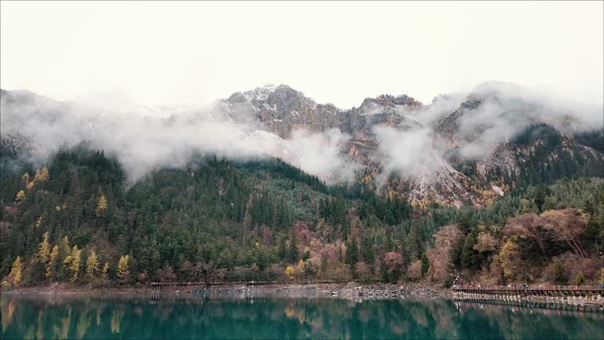 Scenery Jiuzhaigou national park in Sichuan, China. Beautiful Long lake and snow mountain in Autumn season. Famous Landmark and Vacation near Chengdu, China. Asia travel concept