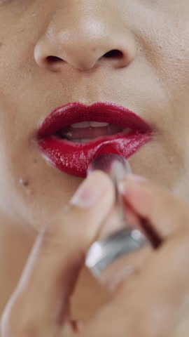 Lipstick, mouth and woman with makeup for beauty, aesthetic and apply red color for shine finish. Cosmetology, self care and female person with glossy balm for pigment glow, wellness and closeup
