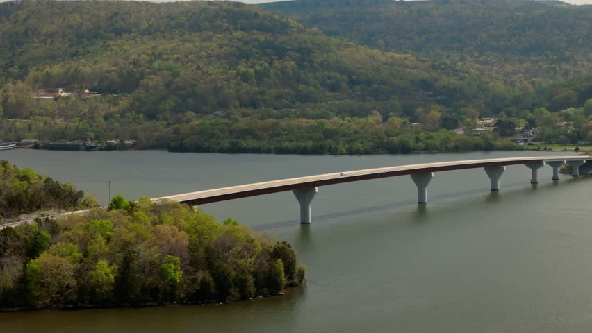 An aerial view of the bridge across wide Tennessee River on Marion County Park near Chattanooga on a sunny day in Tennessee, USA