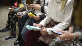 Children using smartphones and mobile phones in school, highlighting modern technology, digital learning, and youth interaction in classrooms. - Powered by Shutterstock - Get 15% off with code: PIKWIZARD15