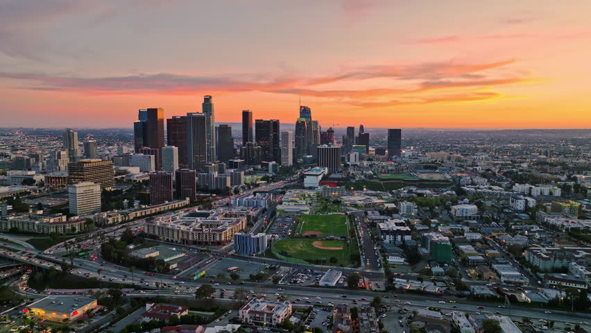 Skyscrapers in Los Angeles. LA skyline in sunset. Sunset over California city. Sunset in Los Angeles. Drone view of Los Angeles skyline. Los Angeles aerial view cityscape. LA skyscrapers in dusk.