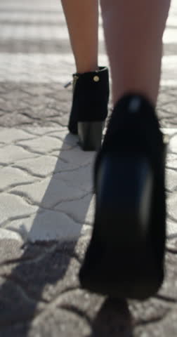 Fashion, walking or legs on street with high heels, trendy shoes or chic style in designer clothing. Outfit, stylish or woman in town with confidence, elegant footwear or boots on city stroll.