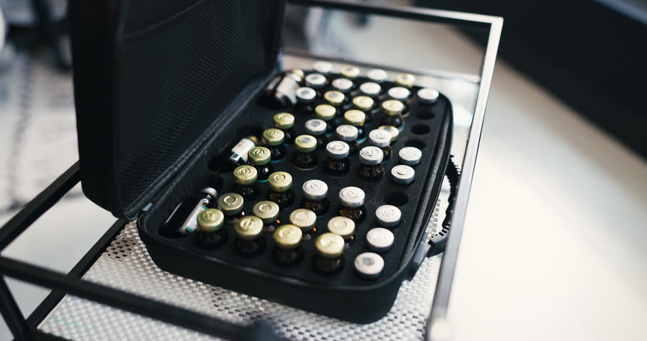 Bag, vitamin liquid and vial on cart for wellness, hydration benefits and immune system improvement. Safe storage, increase energy and supplement fluid in case, detox and skin health from above