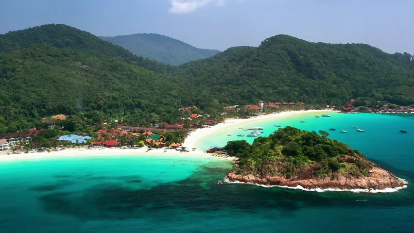 Long Beach beach with mountains on Redang Island, Malaysia. A tropical paradise in the South China Sea